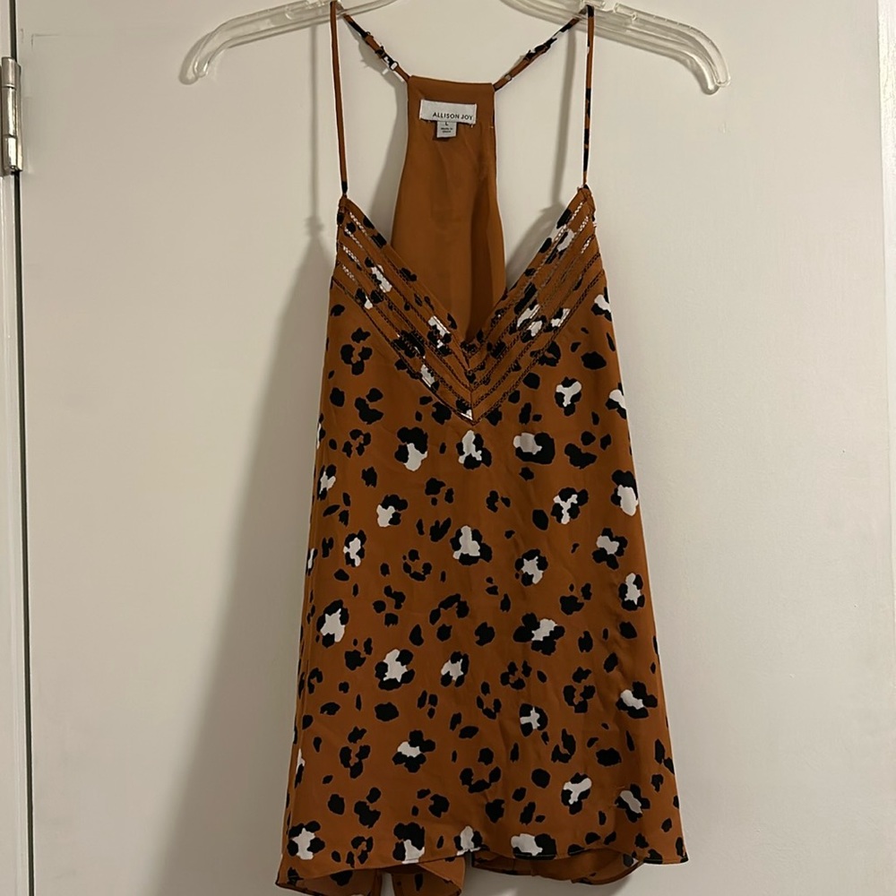 Cheeta print adjustable racer back tank top. Orange, black, white